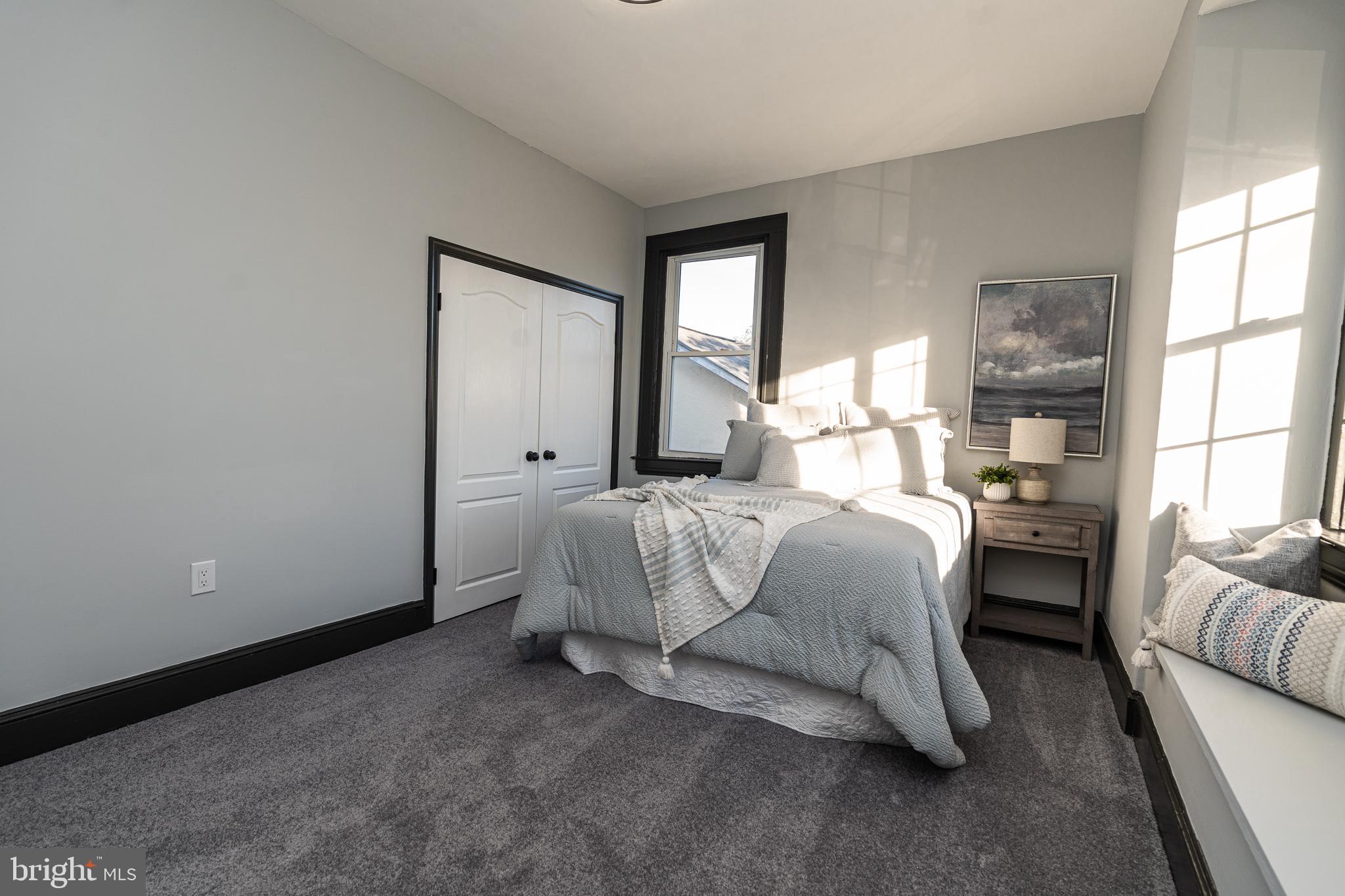 3910 Chatham Road Baltimore, MD 21207 - Photo 36 of 52 a bedroom with a bed and a window