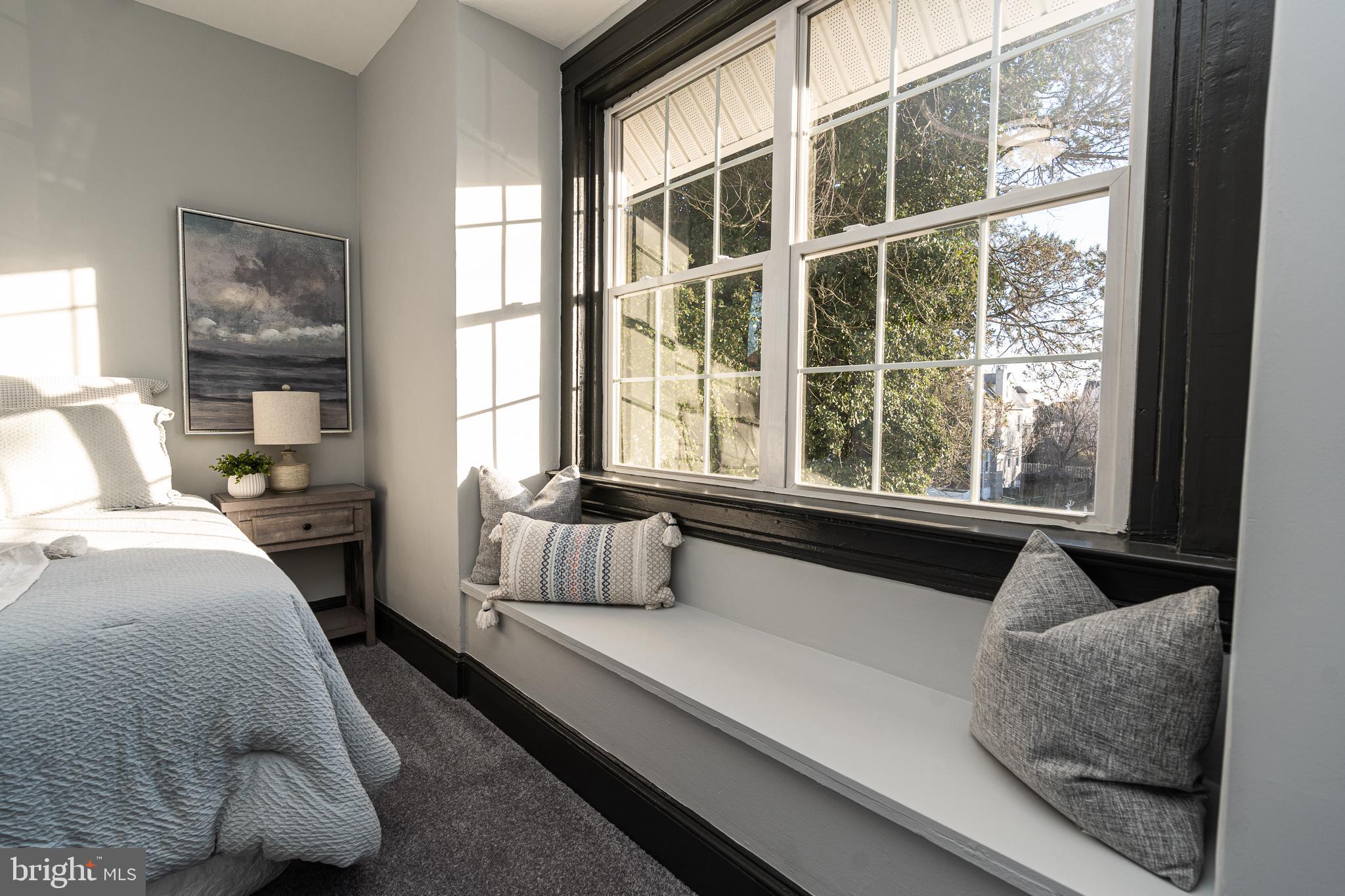 3910 Chatham Road Baltimore, MD 21207 - Photo 37 of 52 a spacious bedroom with a bed and a large window