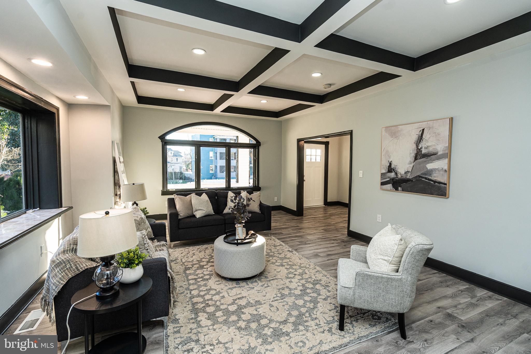 3910 Chatham Road Baltimore, MD 21207 - Photo 4 of 52 a living room with furniture and a potted plant