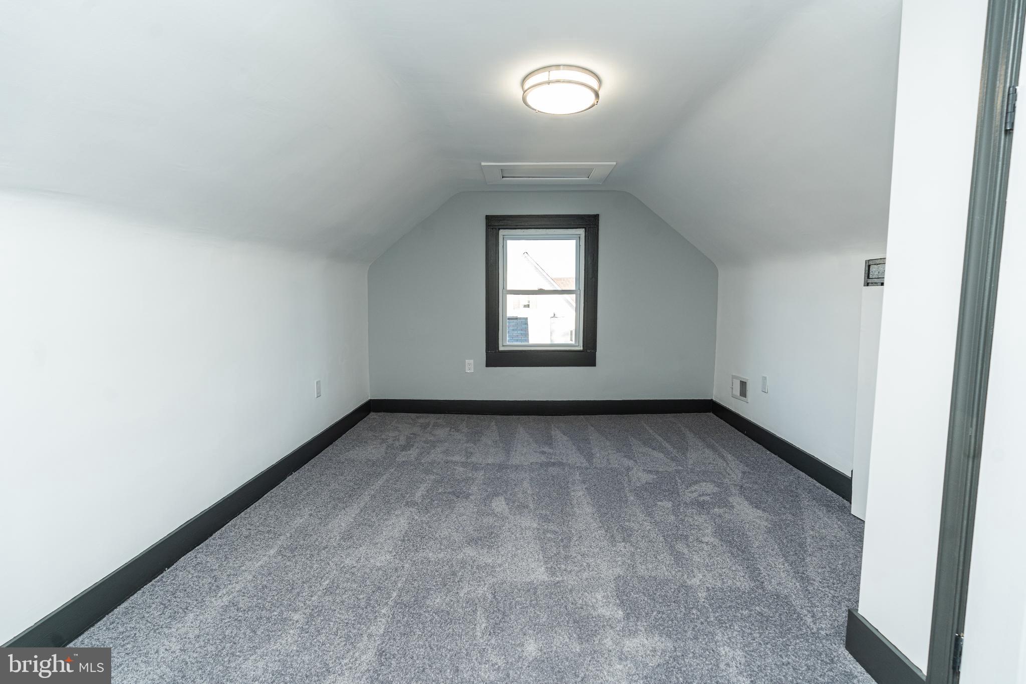 3910 Chatham Road Baltimore, MD 21207 - Photo 43 of 52 an empty room with a window