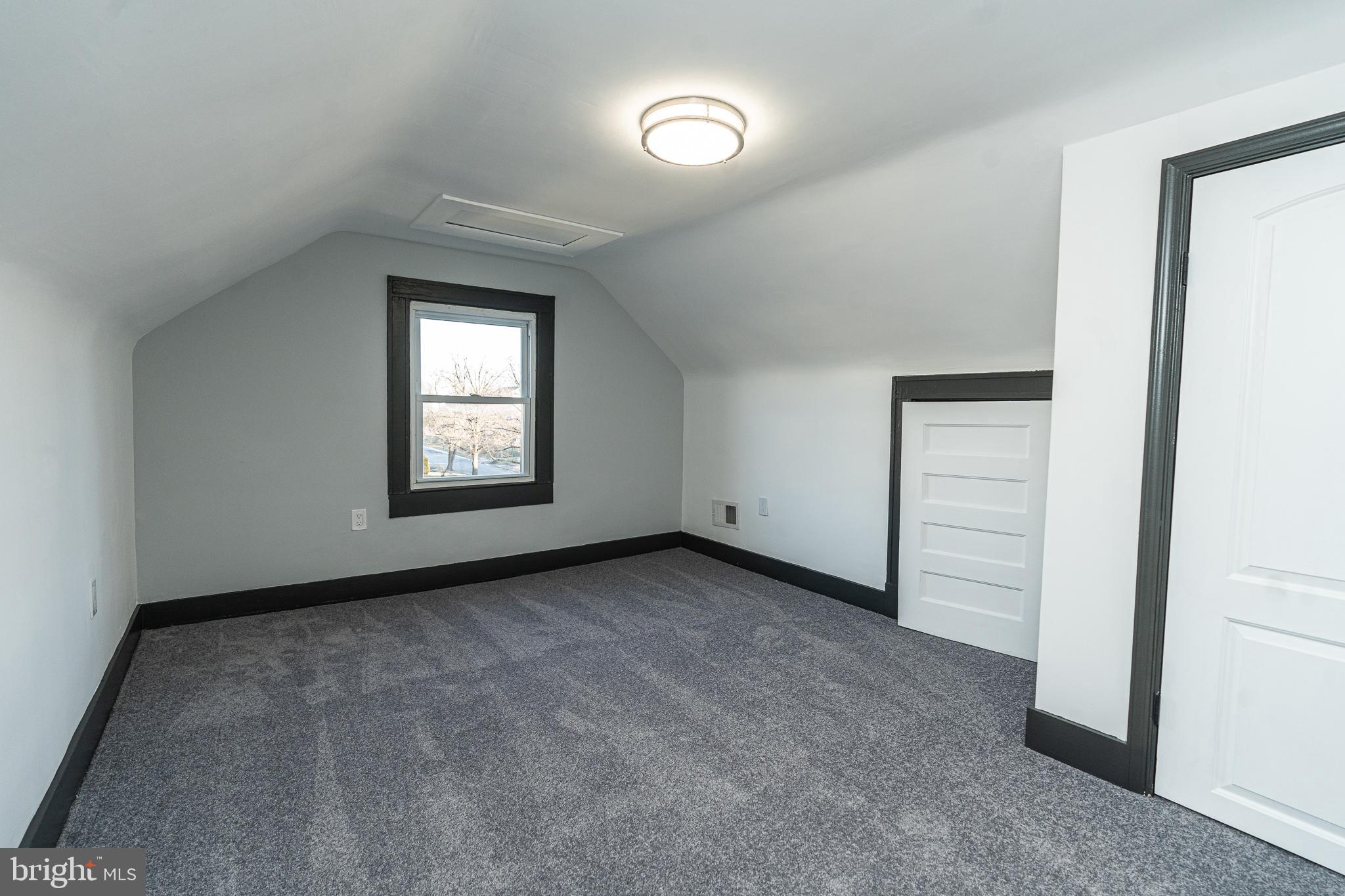 3910 Chatham Road Baltimore, MD 21207 - Photo 44 of 52 an empty room with windows and closet