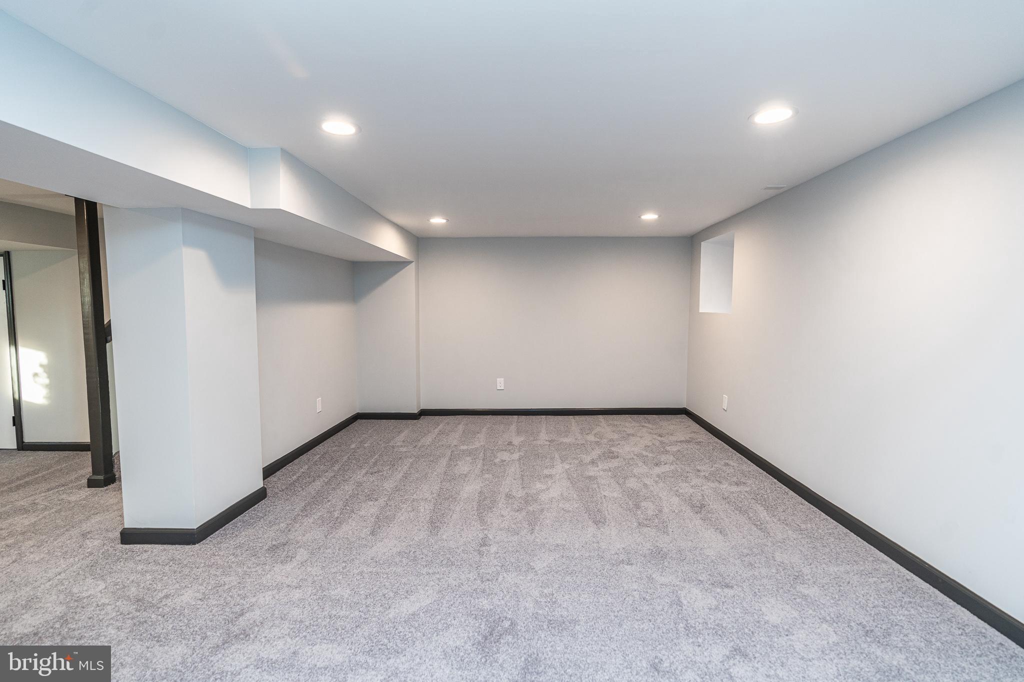 3910 Chatham Road Baltimore, MD 21207 - Photo 45 of 52 an empty room with a empty space and windows