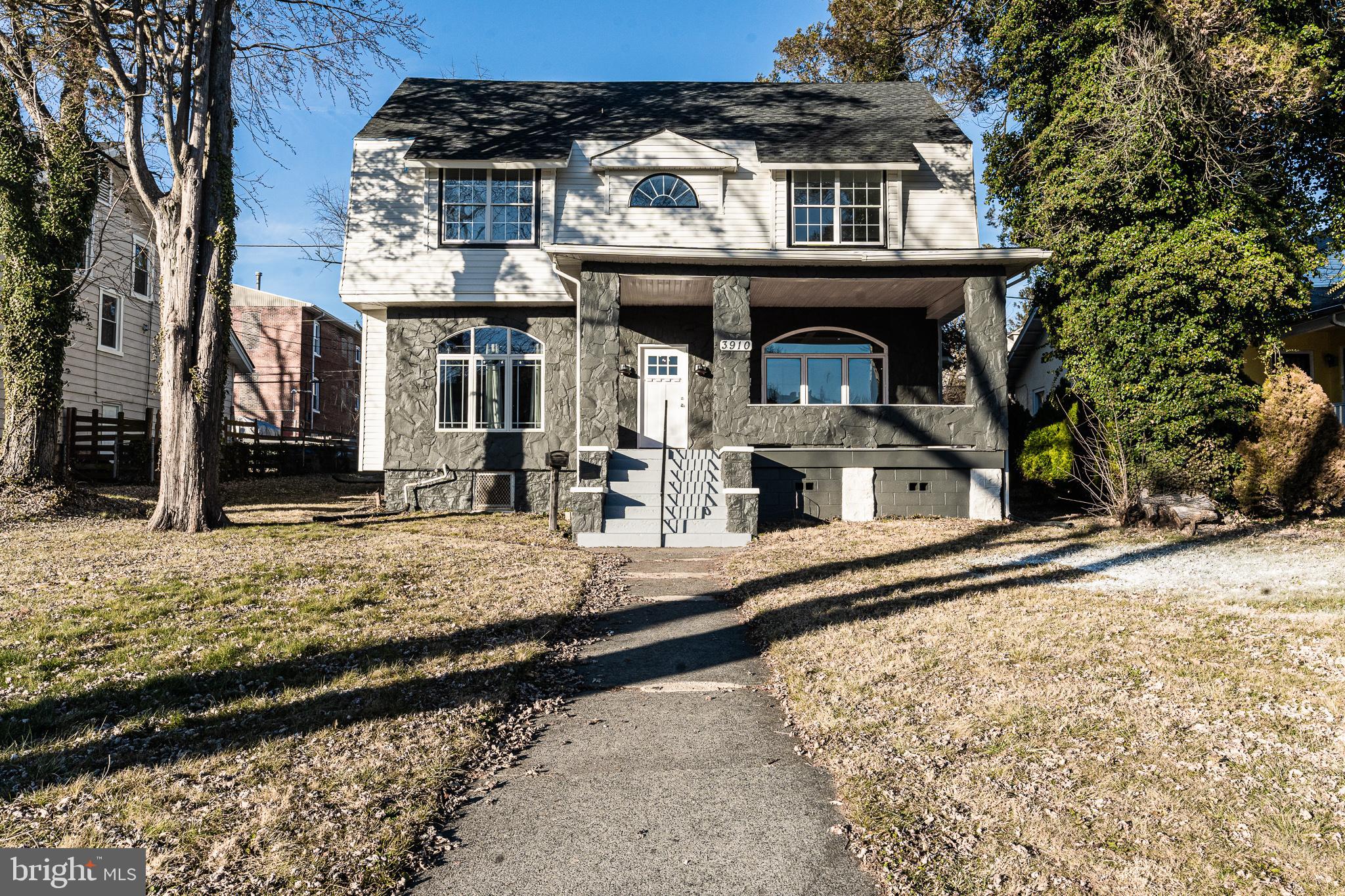 3910 Chatham Road Baltimore, MD 21207 - Photo 52 of 52 a front view of a house with large windows