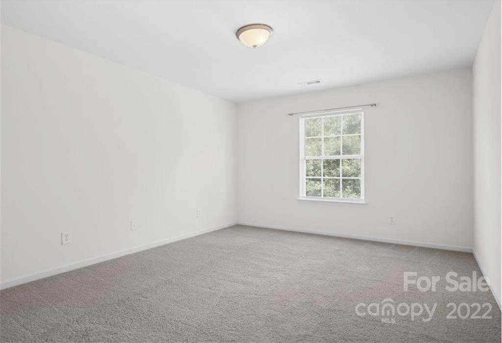 1224 Afternoon Sun Road Matthews, NC 28104 - Photo 12 of 22 an empty room with windows
