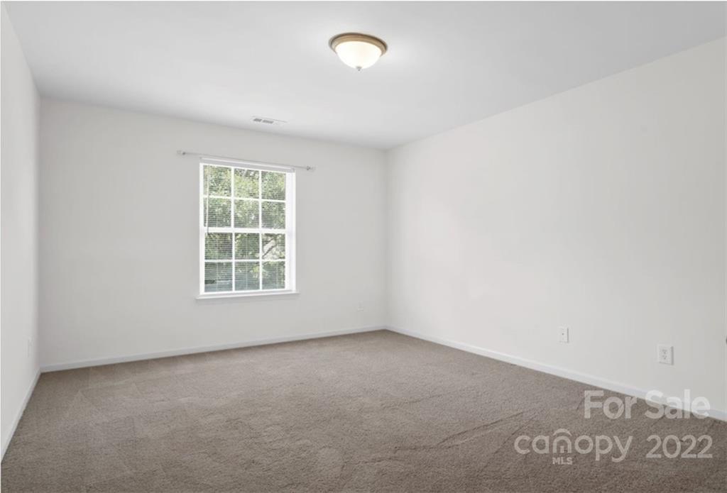1224 Afternoon Sun Road Matthews, NC 28104 - Photo 13 of 22 an empty room with a window
