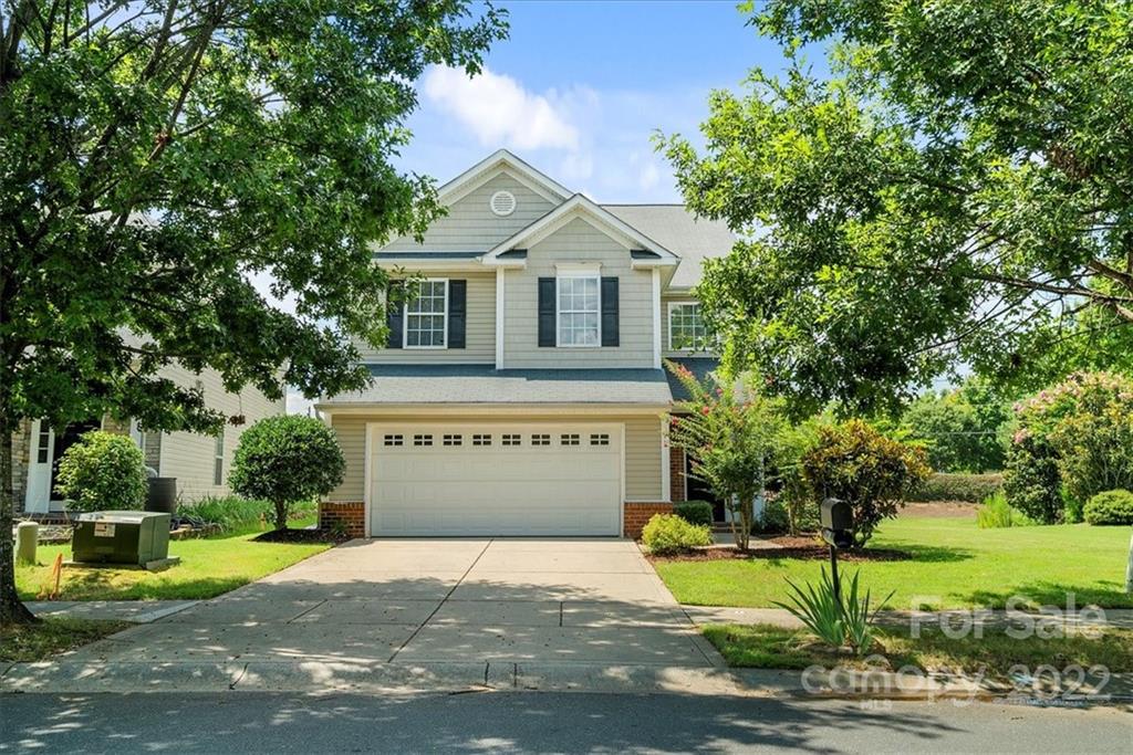 1224 Afternoon Sun Road Matthews, NC 28104 - Photo 22 of 22 a front view of a house with a garden