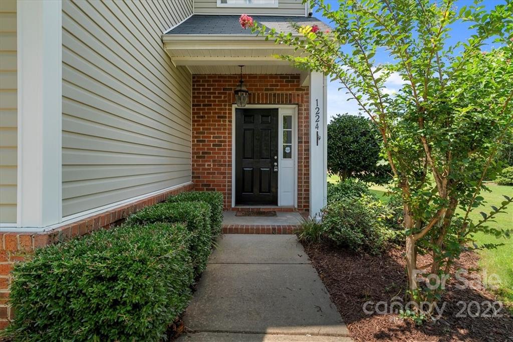 1224 Afternoon Sun Road Matthews, NC 28104 - Photo 3 of 22 a front view of a house with garden