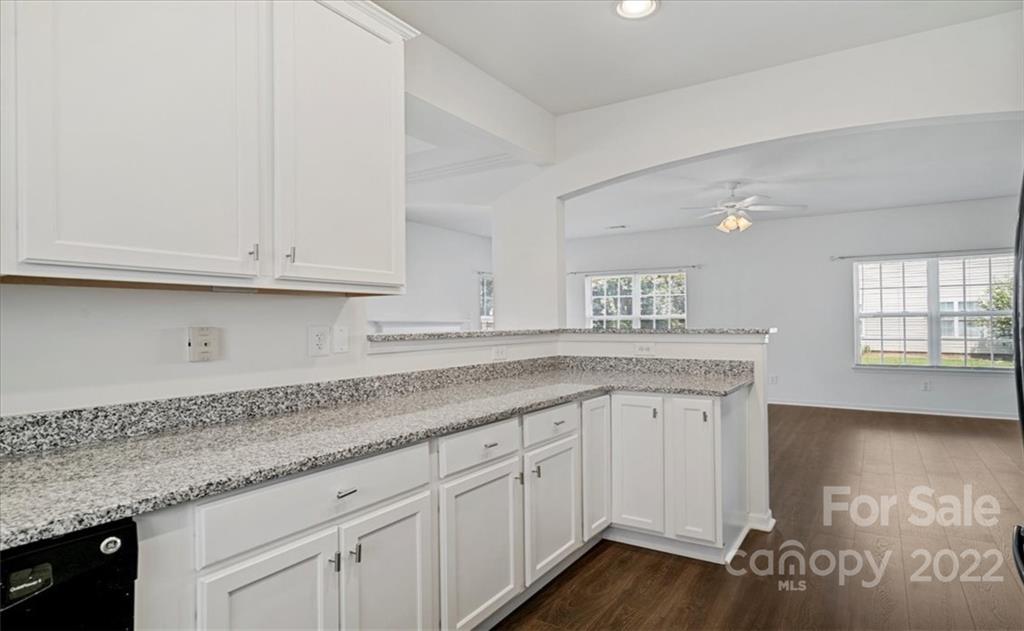 1224 Afternoon Sun Road Matthews, NC 28104 - Photo 5 of 22 a kitchen with granite countertop white cabinets and a sink