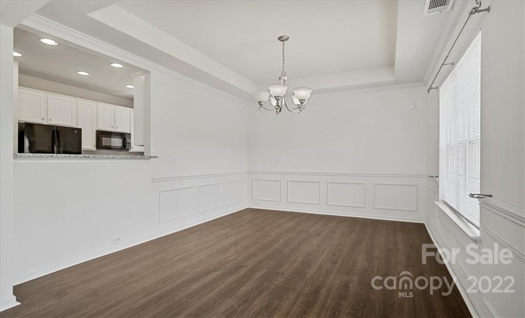 1224 Afternoon Sun Road Matthews, NC 28104 - Photo 6 of 22 wooden floor in an empty room with a window