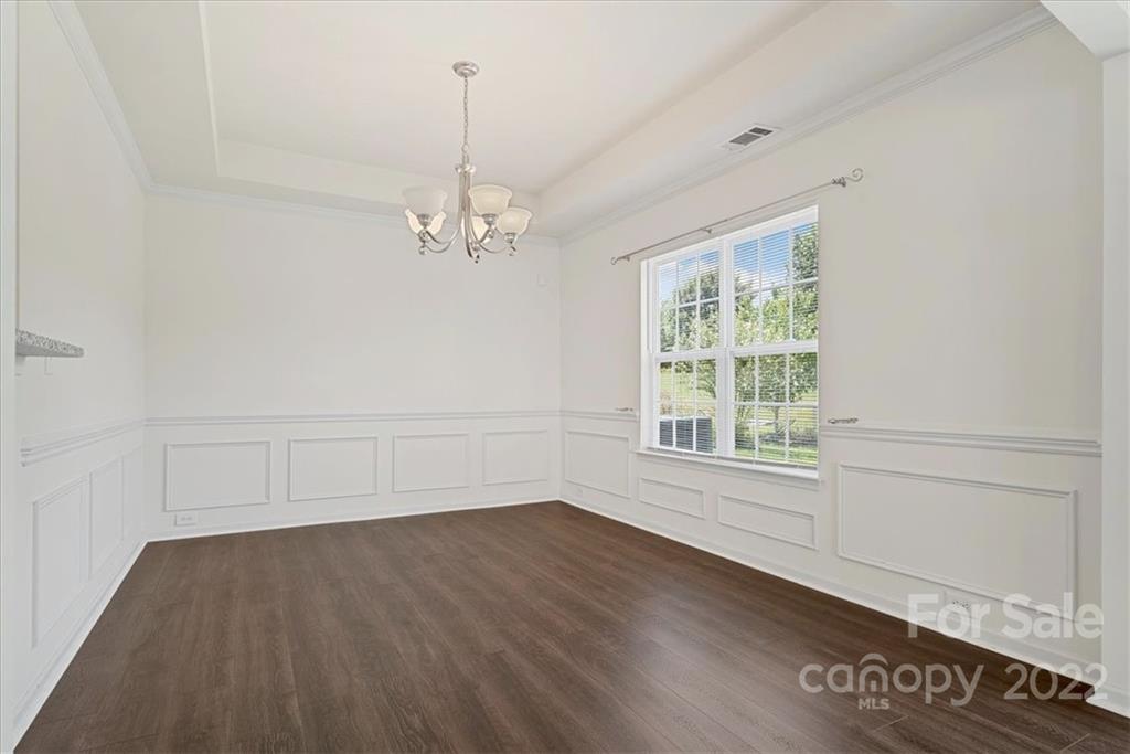 1224 Afternoon Sun Road Matthews, NC 28104 - Photo 7 of 22 wooden floor in an empty room with a window