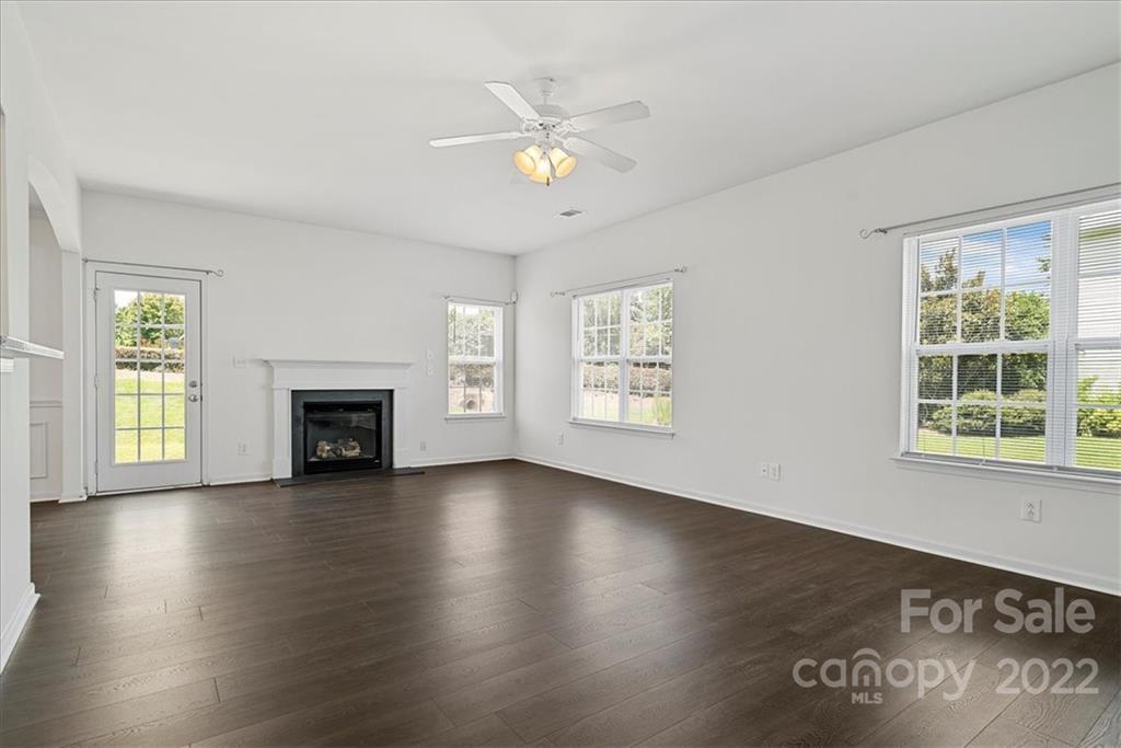 1224 Afternoon Sun Road Matthews, NC 28104 - Photo 8 of 22 a view of an empty room with wooden floor and a window