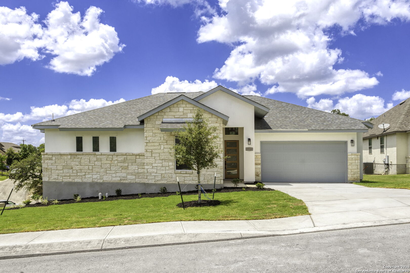a front view of house with garage and yard