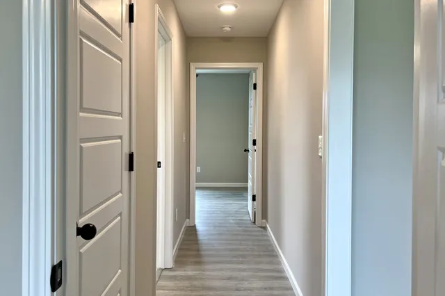 a view of a bathroom from the hallway