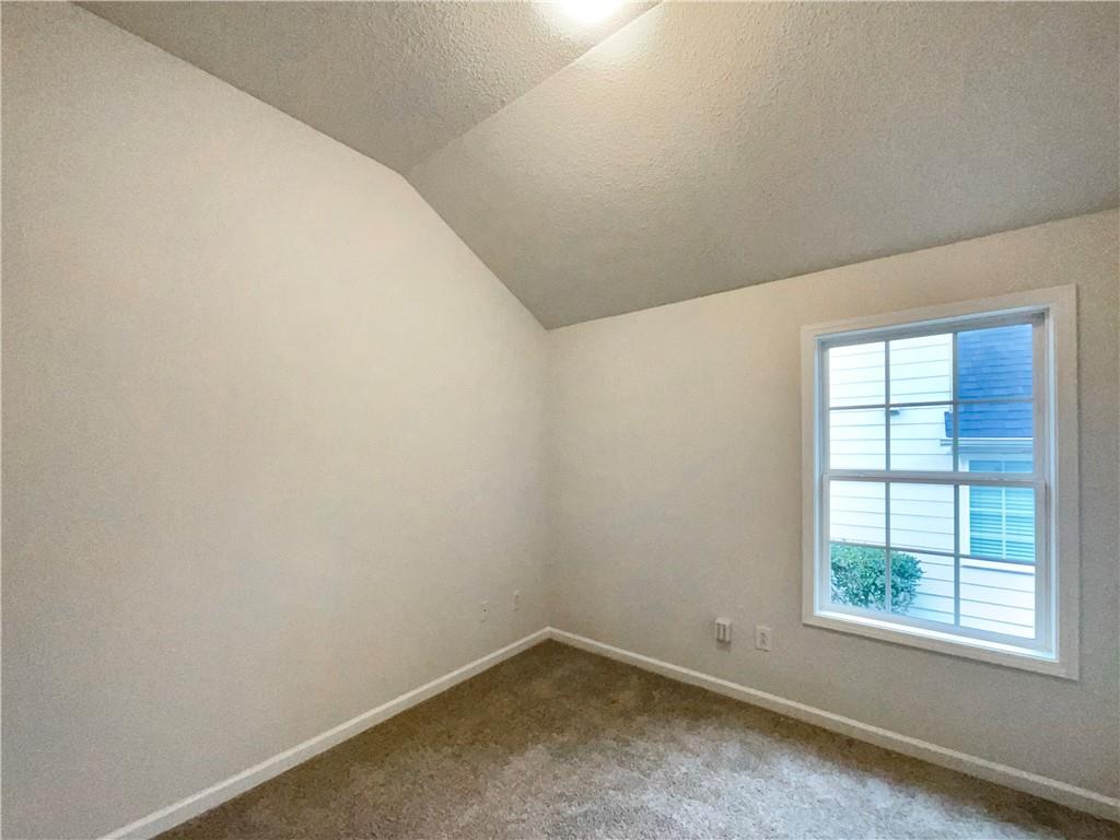 5945 Raventree Court Atlanta, GA 30349 - Photo 11 of 27 an empty room with a window