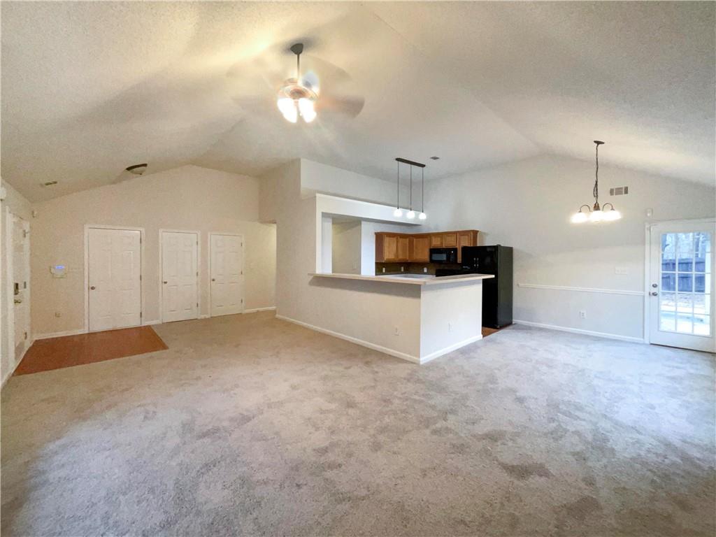 5945 Raventree Court Atlanta, GA 30349 - Photo 17 of 27 a view of a kitchen with a sink and a refrigerator