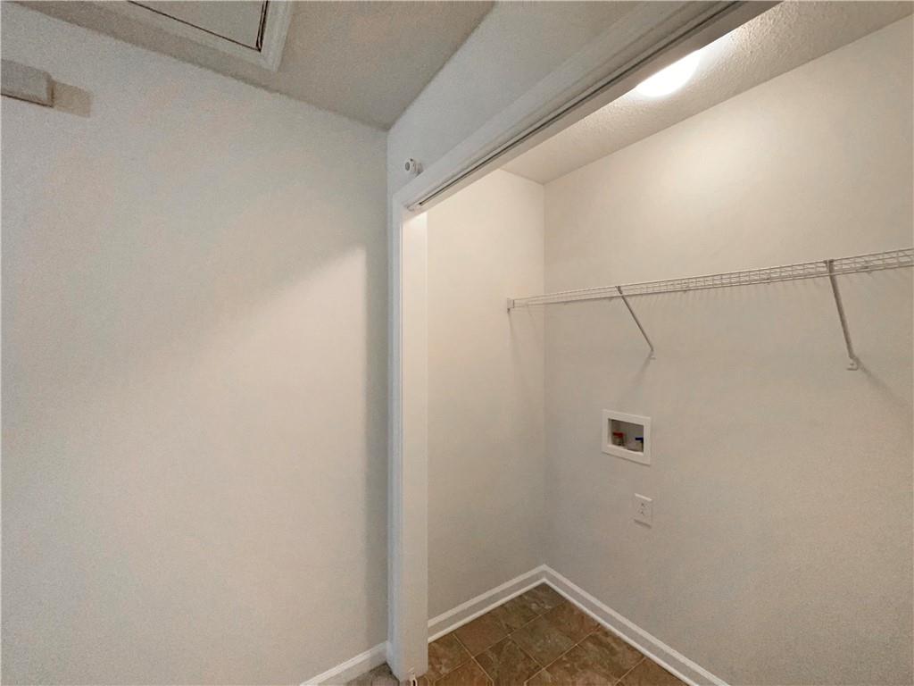 5945 Raventree Court Atlanta, GA 30349 - Photo 22 of 27 a small space with a shower and closet