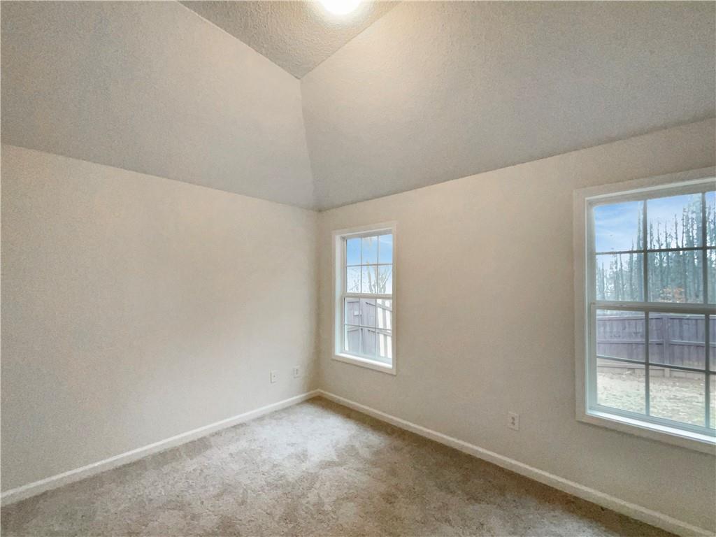 5945 Raventree Court Atlanta, GA 30349 - Photo 10 of 27 an empty room with a window