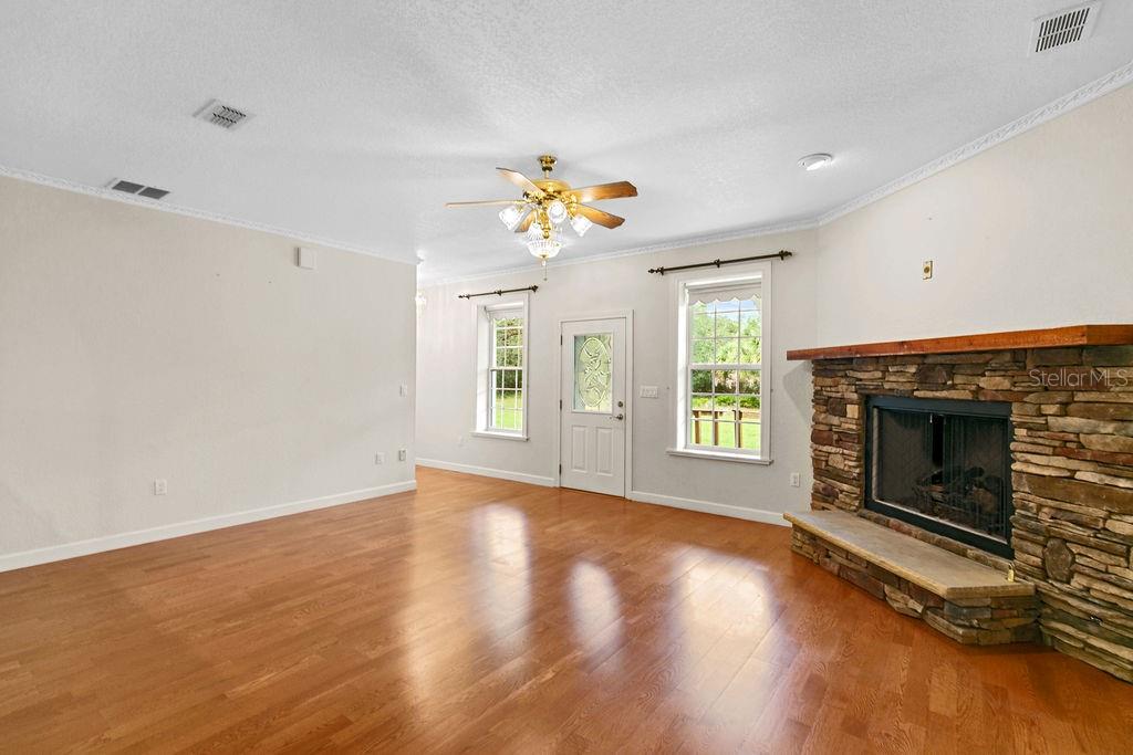 2691 Phillips Road Christmas, FL 32709 - Photo 12 of 38 a view of an empty room with window and fireplace