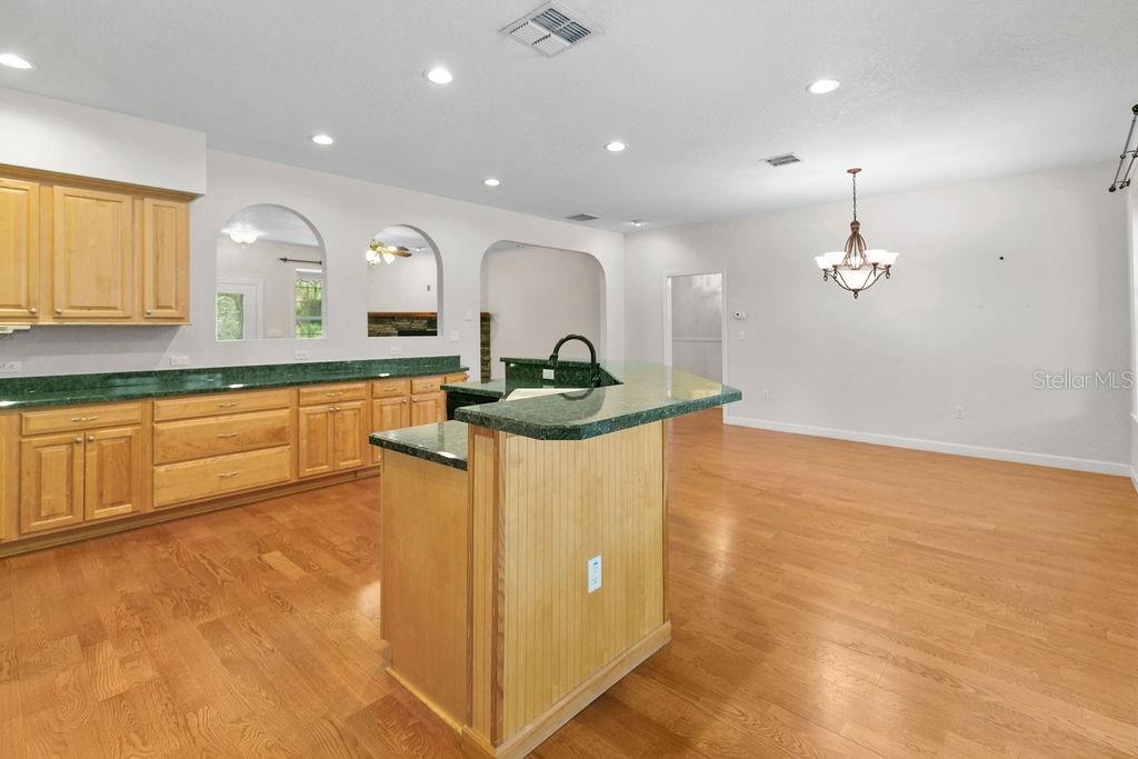 2691 Phillips Road Christmas, FL 32709 - Photo 15 of 38 a kitchen with kitchen island a counter top space appliances and a window