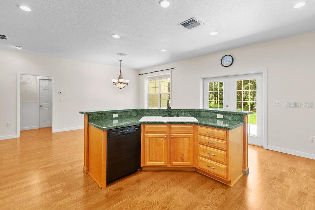 2691 Phillips Road Christmas, FL 32709 - Photo 16 of 38 a kitchen with stainless steel appliances granite countertop a sink and a stove