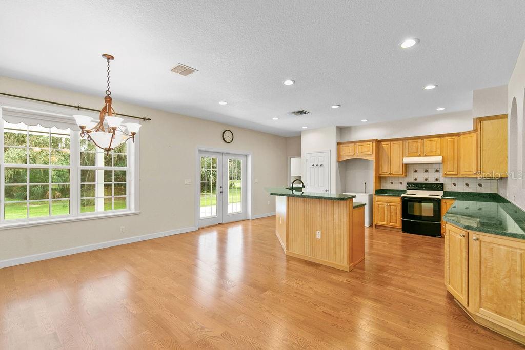 2691 Phillips Road Christmas, FL 32709 - Photo 17 of 38 a view of kitchen with wooden floor and large window