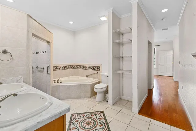 a bathroom with a tub sink and a shower