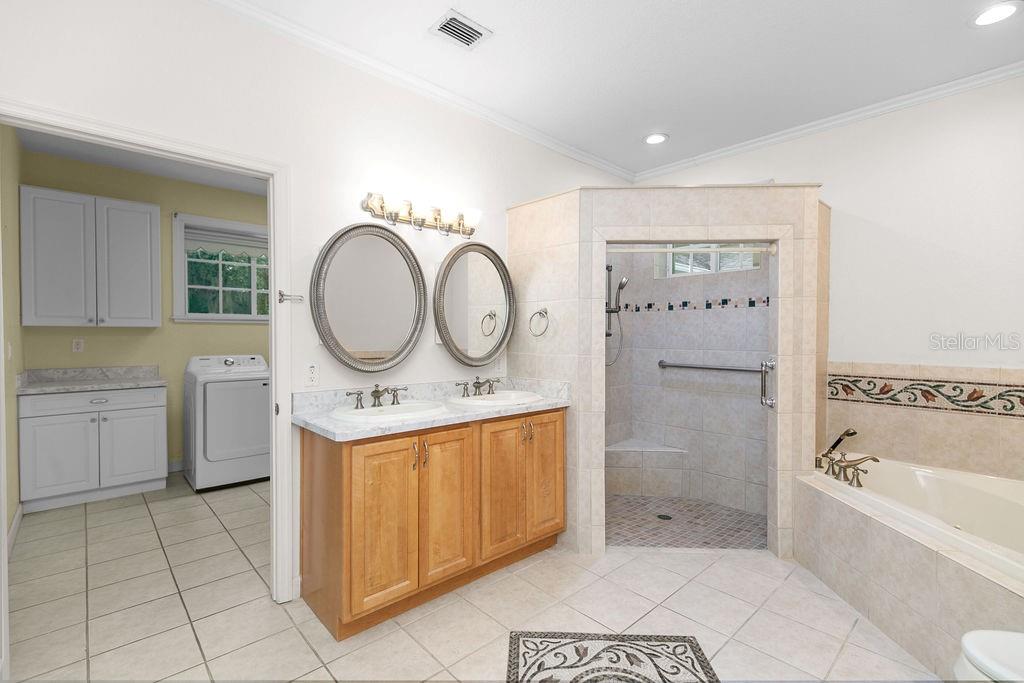 2691 Phillips Road Christmas, FL 32709 - Photo 22 of 38 a bathroom with a sink a toilet and bathtub