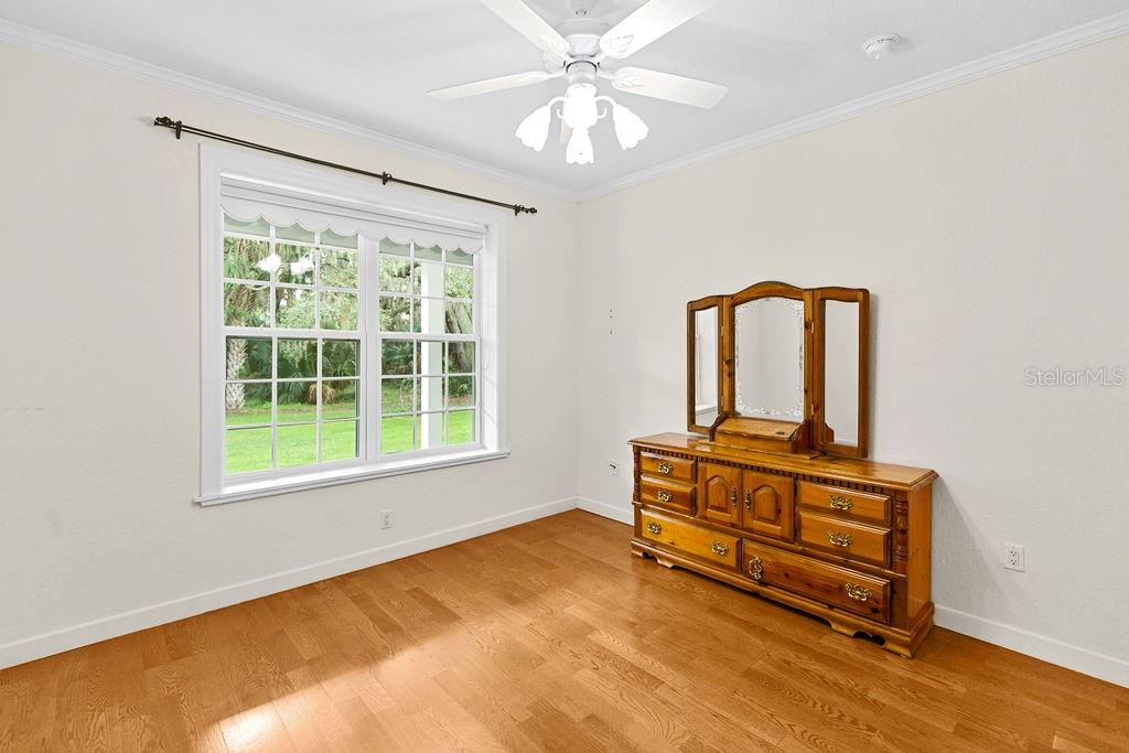 2691 Phillips Road Christmas, FL 32709 - Photo 28 of 38 an empty room with windows and ceiling fan