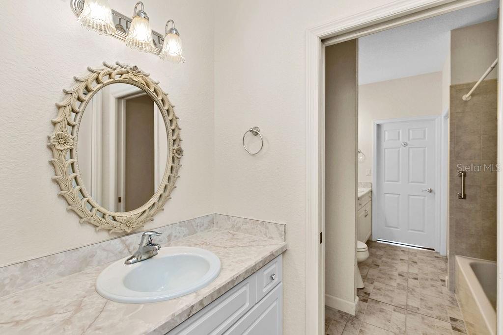 2691 Phillips Road Christmas, FL 32709 - Photo 30 of 38 a bathroom with a sink and a mirror