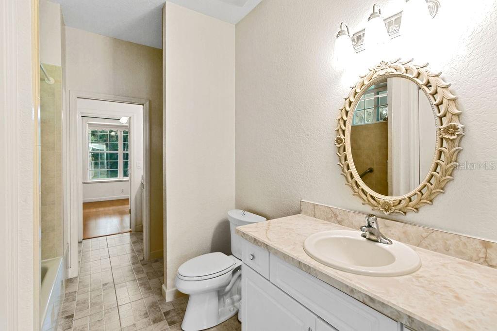 2691 Phillips Road Christmas, FL 32709 - Photo 32 of 38 a bathroom with a sink and a mirror