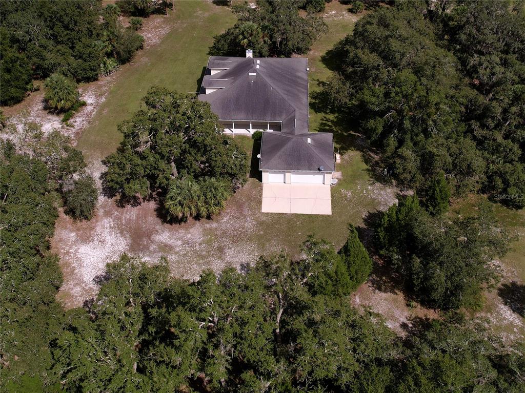 2691 Phillips Road Christmas, FL 32709 - Photo 37 of 38 an aerial view of residential house with outdoor space and trees all around