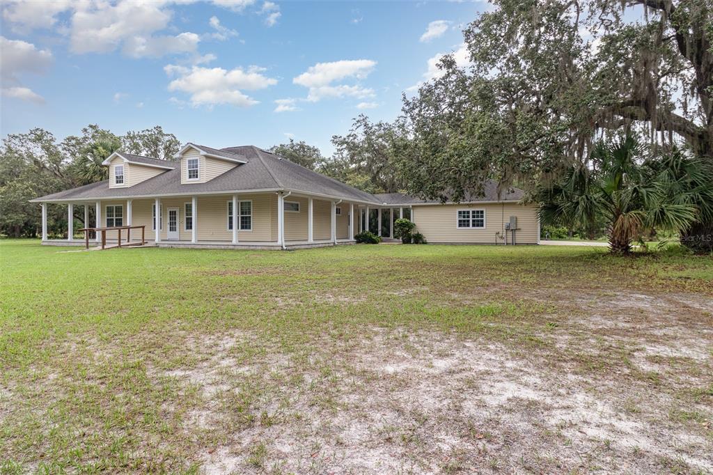 2691 Phillips Road Christmas, FL 32709 - Photo 4 of 38 a view of a house with a yard and sitting area