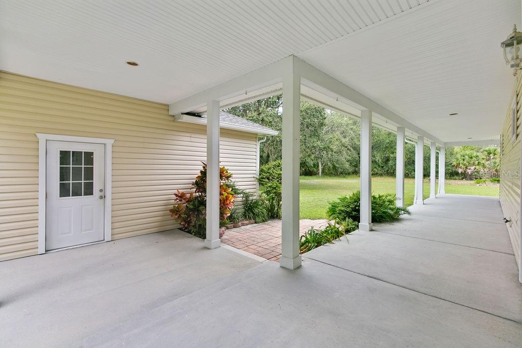 2691 Phillips Road Christmas, FL 32709 - Photo 10 of 38 a view of a garden with porch
