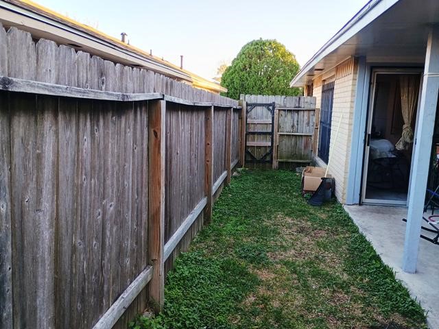 3822 Mattingham Drive Houston, TX 77066 - Photo 16 of 18 a view of a backyard with wooden fence