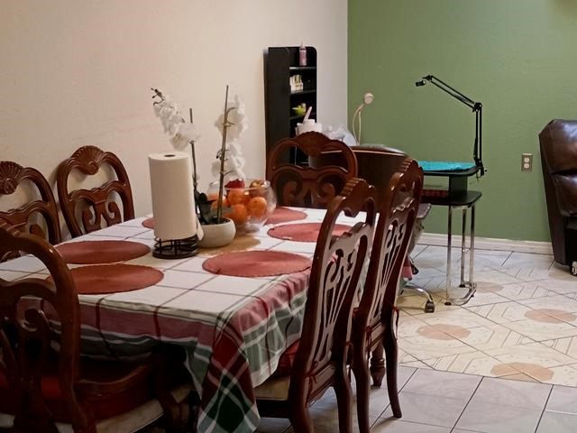 3822 Mattingham Drive Houston, TX 77066 - Photo 5 of 18 a view of a dining room with furniture and chandelier