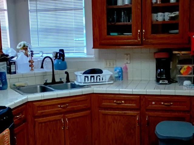 3822 Mattingham Drive Houston, TX 77066 - Photo 8 of 18 a kitchen with granite countertop a sink and cabinets
