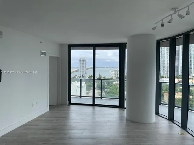 a view of kitchen with stainless steel appliances granite countertop a stove top oven