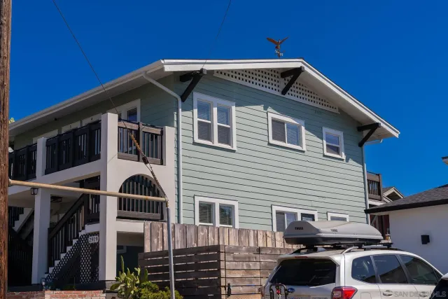 a front view of a house with parking space