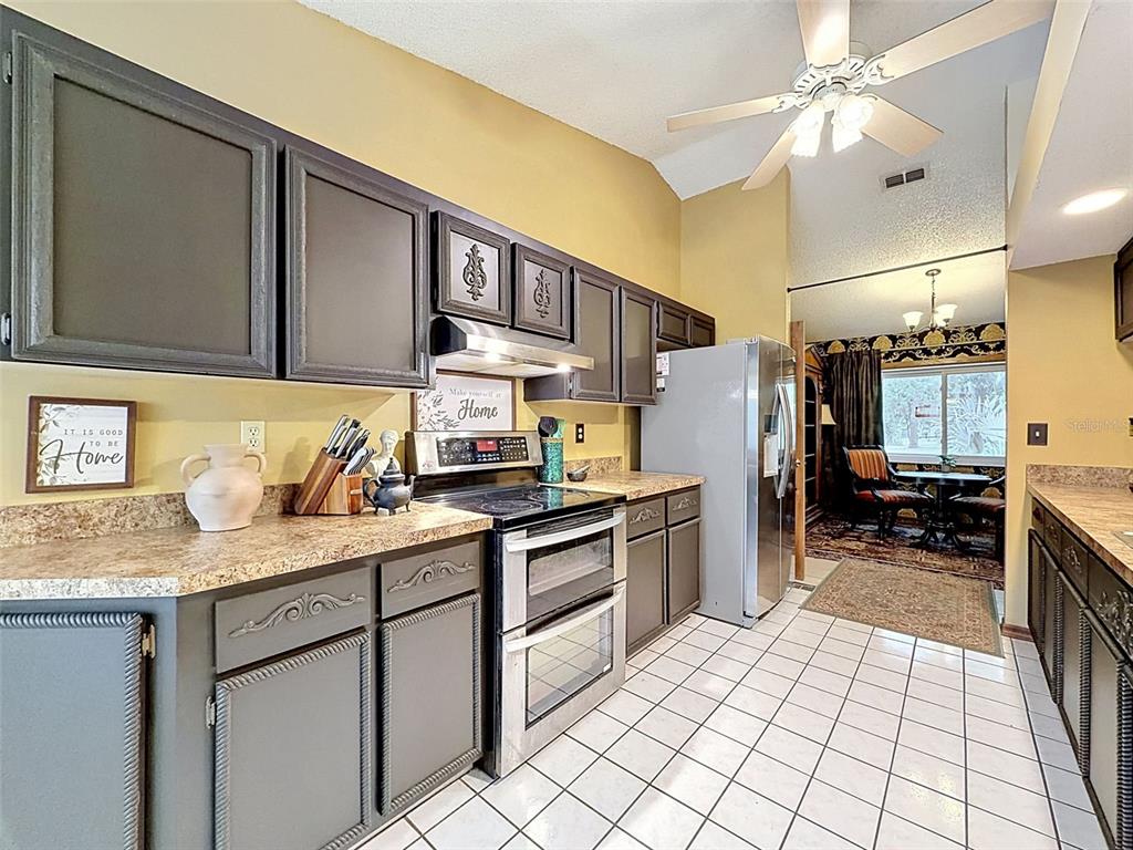 7111 Ricker Avenue Webster, FL 33597 - Photo 14 of 41 a kitchen with a sink appliances and cabinets
