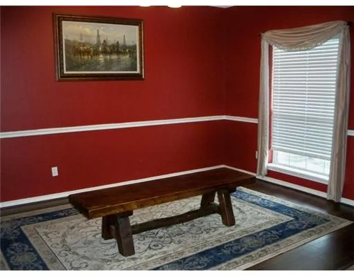 a bench sitting in a room next to a window