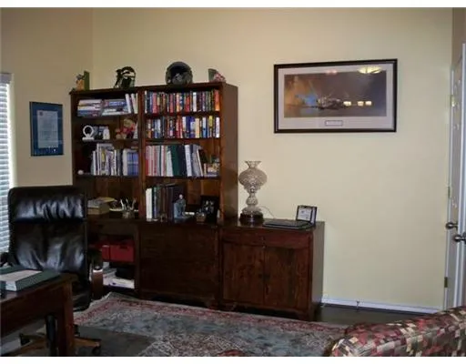 a view of a workspace with bookshelf