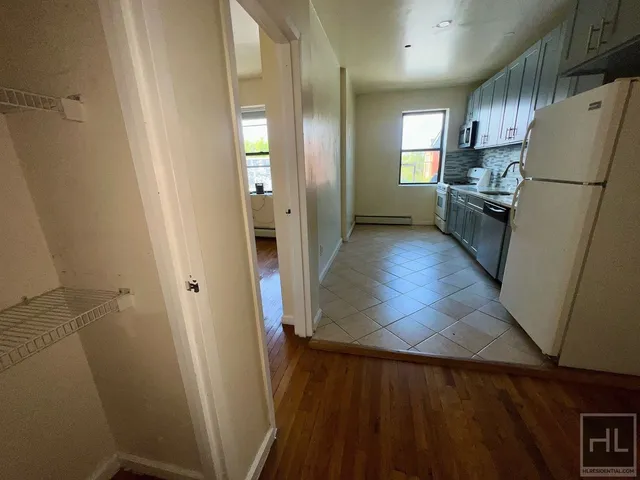a kitchen with stainless steel appliances granite countertop a refrigerator sink and cabinets