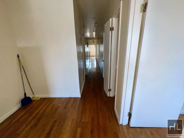 a bathroom with a toilet a sink and a mirror