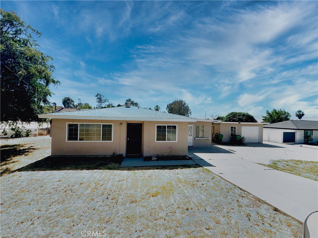 16125 Gamble Avenue Riverside, CA 92508 - Photo 1 of 1 a front view of a house with a yard