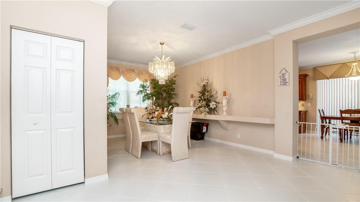 934 Crestview Circle Fort Lauderdale, FL 33327 - Photo 12 of 51 a view of dining room with furniture and chandelier