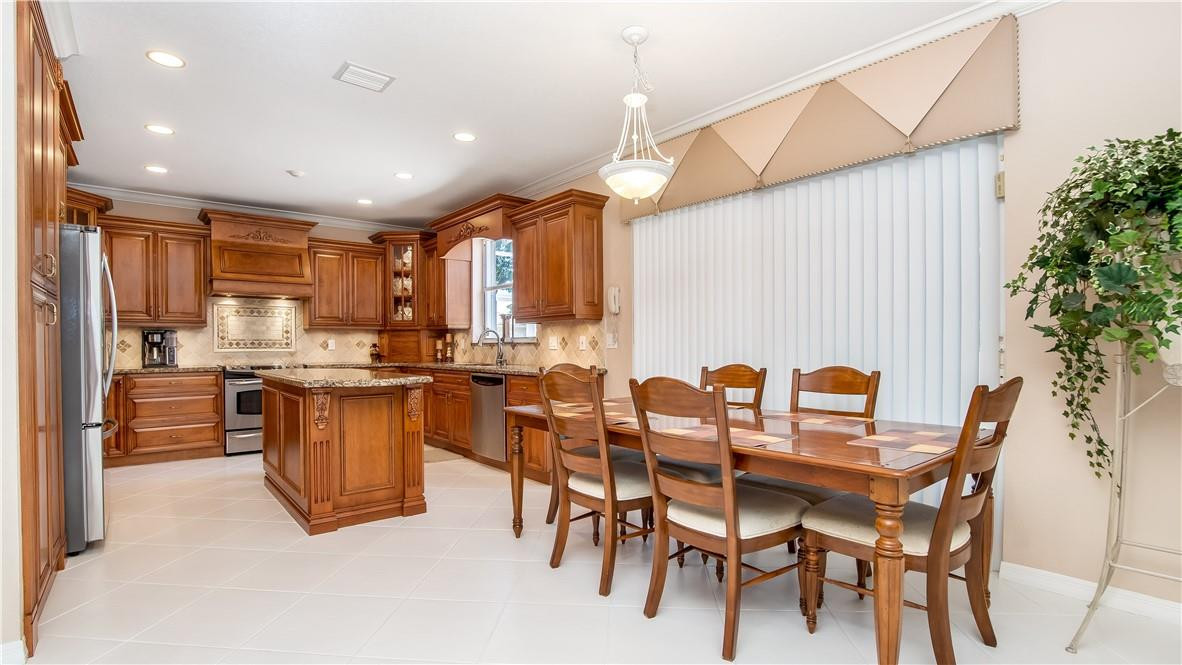 934 Crestview Circle Fort Lauderdale, FL 33327 - Photo 16 of 51 a kitchen with cabinets and chairs