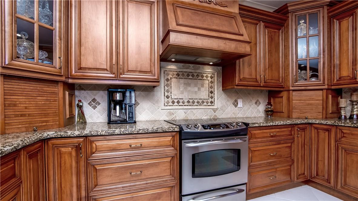 934 Crestview Circle Fort Lauderdale, FL 33327 - Photo 18 of 51 a kitchen with granite countertop stainless steel appliances and cabinets
