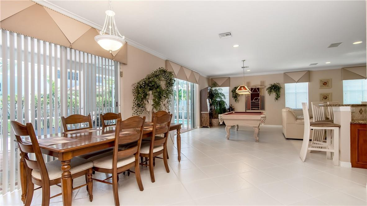 934 Crestview Circle Fort Lauderdale, FL 33327 - Photo 22 of 51 a view of a dining room with furniture window and outside view