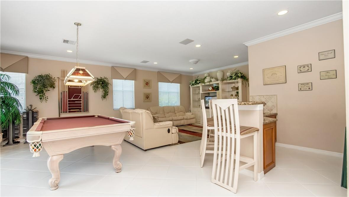 934 Crestview Circle Fort Lauderdale, FL 33327 - Photo 24 of 51 a living room with furniture a rug and white walls