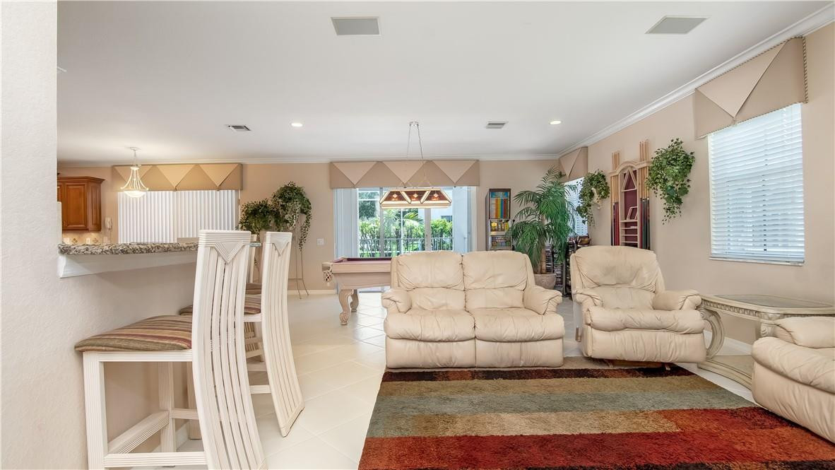 934 Crestview Circle Fort Lauderdale, FL 33327 - Photo 28 of 51 a living room with furniture and a large window